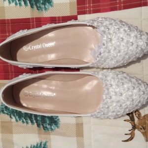 White flowered flat shoes